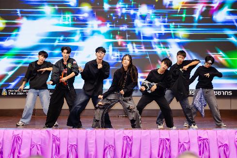 A group of people dancing on a stage Description automatically generated